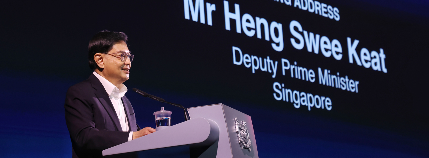 Mr Heng Swee Keat at lectern, Deputy Prime Minister Singapore on screen behind.